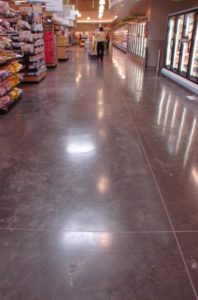 This floor is from a Albertson’s in San Marcos, CA. It was colored with Davis Colors concrete color pigments www.daviscolors.com. Color used in this picture is Ivory. Superior was the ready mix plant which provided the concrete www.superiorrm.com. The contractor was Oakley Construction 714-842-1073.