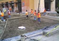 The concrete contractors are placing the concrete.