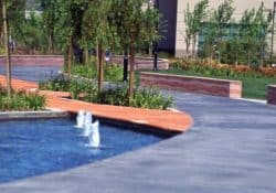 Cisco Systems' Campus - The walkway was colored with Davis Colors' Dark Gray (860) concrete color.  The walls were colored with Davis Colors Brick Red and 1117 at 5 lbs per sack of cement.  The walls all had varying degrees of exposure created by sand blasting the surface.   The concrete had varying levels of concrete colors to achieve the random look of a washed out terrain.