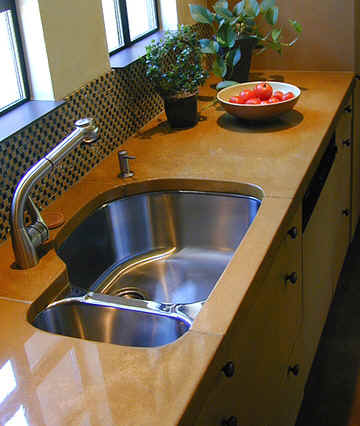 This precast colored concrete kitchen countertop was made by Flying Turtle Cast Concrete (www.flyingturtlecastconcrete.com). The concrete was integrally colored with custom colors using Davis Colors’ quality concrete pigments (www.daviscolors.com).