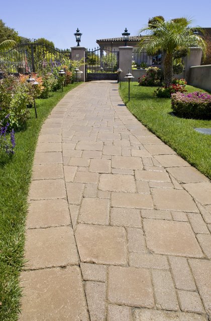 This walkway was paved with Orco Block’s Pacific Cobble pavers and colored with Orco’s own unique Sandstone (B15) color blend.  Orco Block uses Davis Colors concrete pigments to create appealing color blends for their concrete pavers.  To learn more about Orco’s quality products visit them at www.orcopaverswalls.com/home.htm or call them at 800-473-6725.