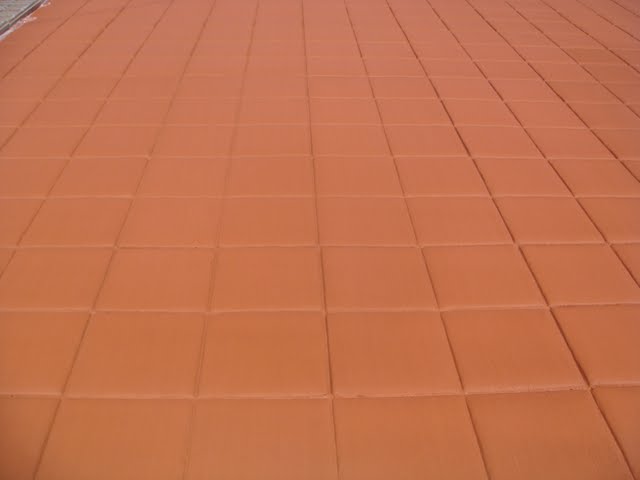Close-up of the stamped Brick Red colored concrete. Concrete pigment is the Brick Red product from Davis Colors