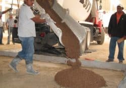 The first batch of Yosemite Brown colored concrete being poured from the ready mix truck.