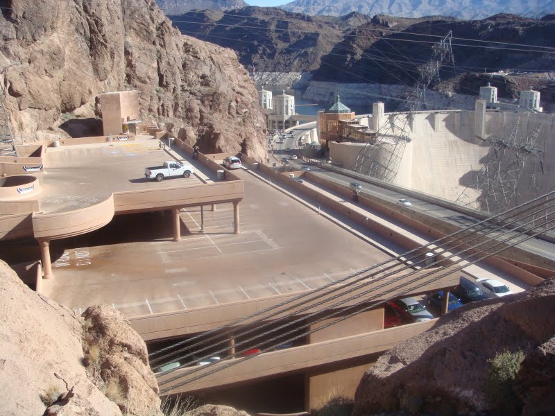 This is a photo of the side vies of the Hoover Dam visitor parking structure with the Hoover Dam in the background.  The parking structure was colored with Davis Colors' Omaha Tan integral concrete colors.