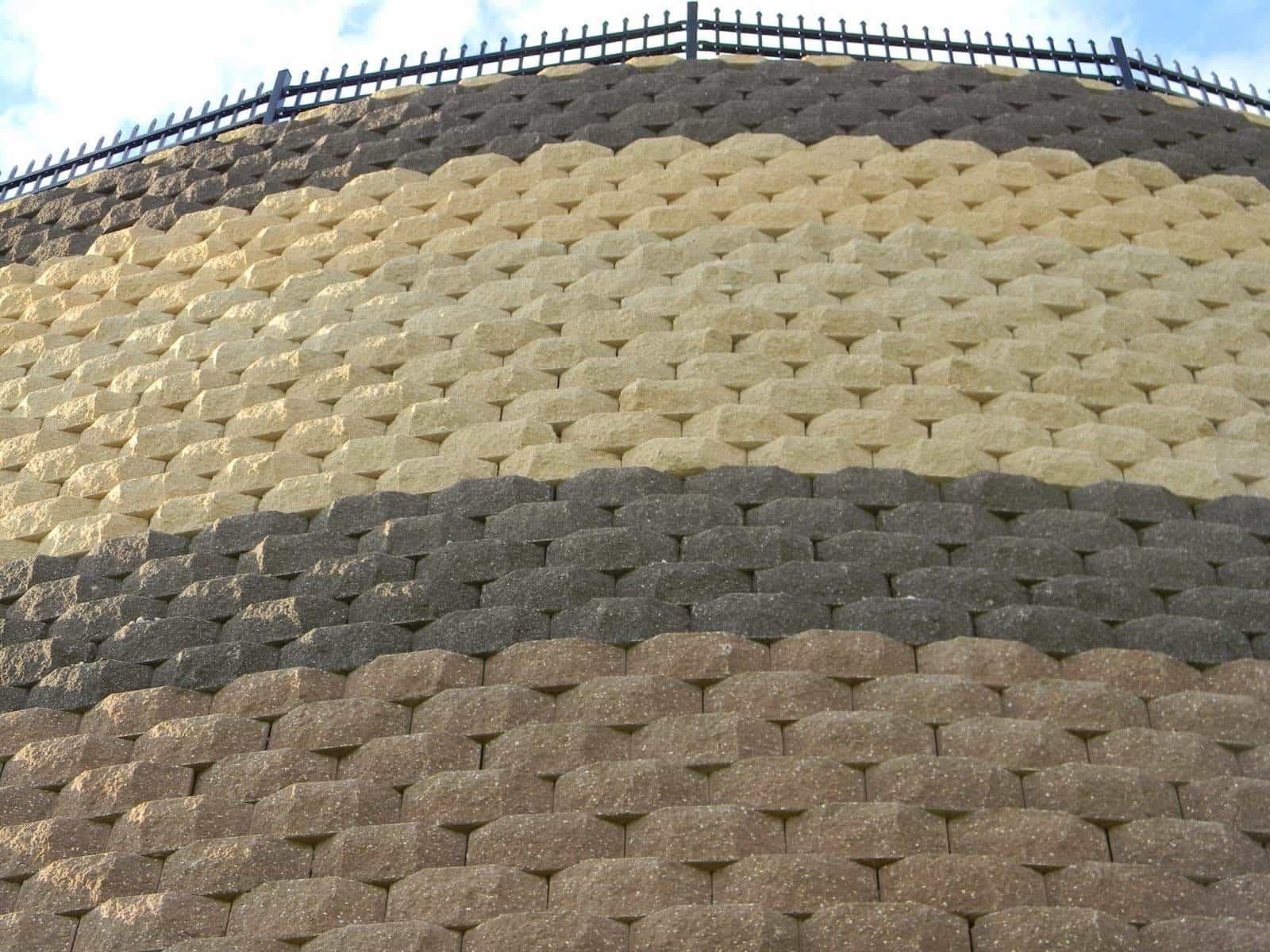 This enormous keystone retaining wall in Abingdon Maryland was built by Griffith Brothers Inc. (410-683-8885) with Keystone Standard units manufactured York Building Products (www.yorkbuilding.com). The colors used were buff, light brown and dark brown.