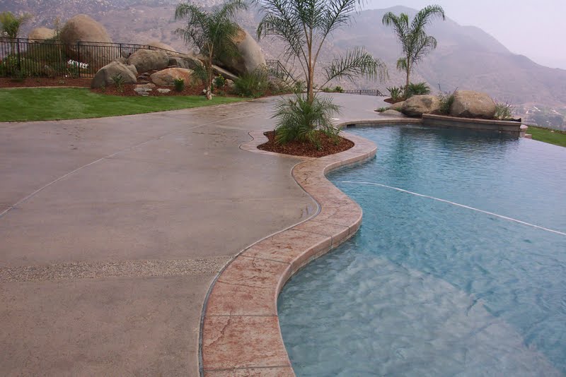 The main pool deck was colored with Davis Colors’ Outback and given a light sand blast finish. The stamped concrete boarders were colored with Davis Colors’ Outback and highlighted with a terra cotta colored release agent.