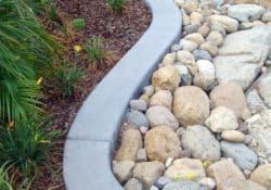 This winding concrete border was colored with Davis Colors' Pewter. The colored concrete was supplied by Superior Ready Mix (www.superiorrm.com).