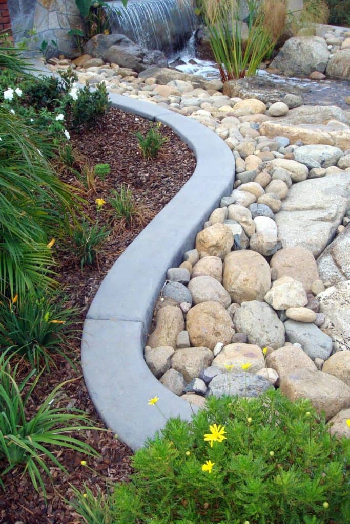 This winding concrete border was colored with Davis Colors' Pewter.