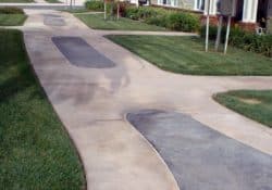 This concrete sidewalk was integrally colored with Davis Colors' Padre Brown with a Walnut release agent and Davis Colors' Meadowbrook Brown (custom color). The colored concrete was supplied by Superior Ready Mix (www.superiorrm.com).