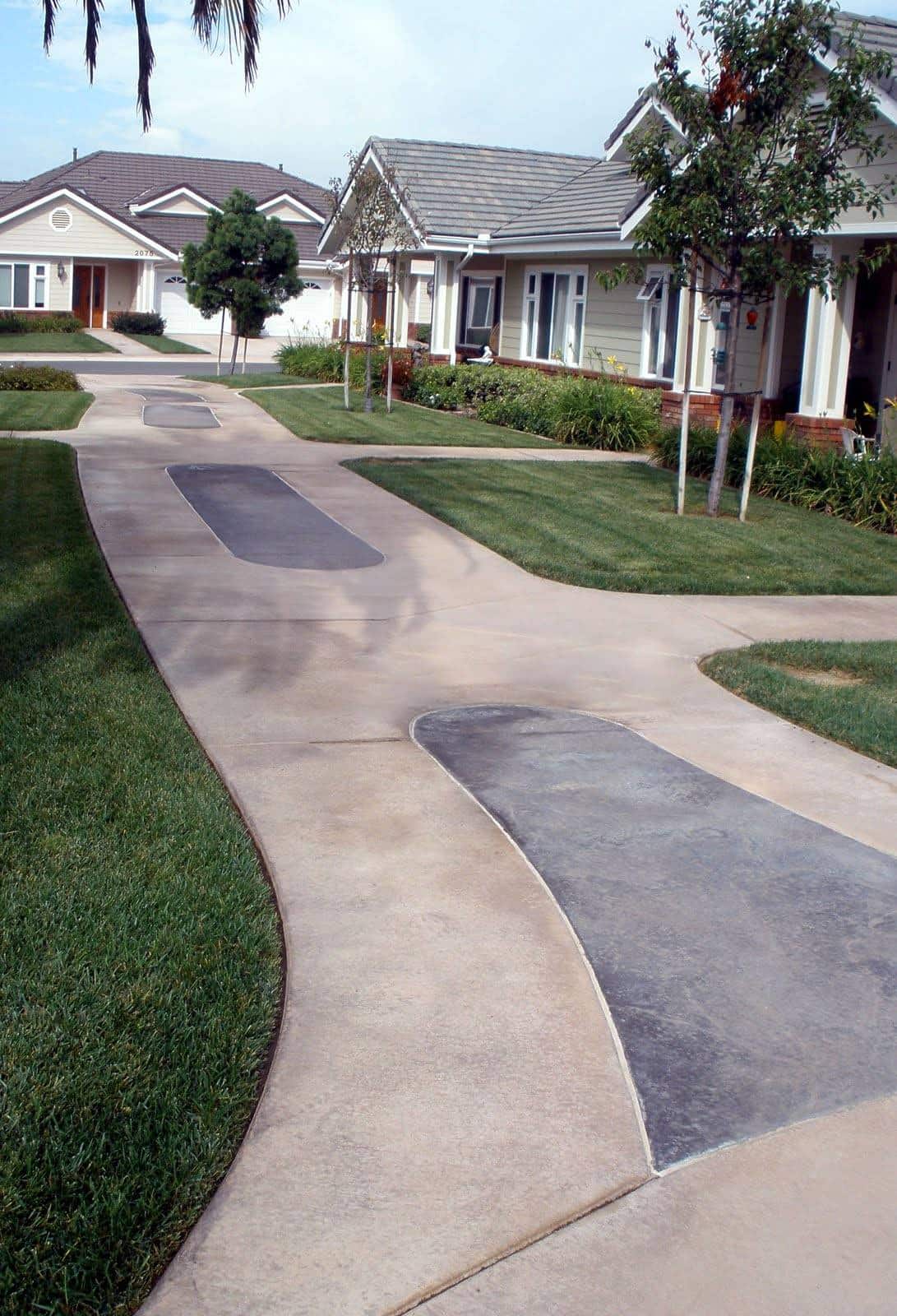 This concrete sidewalk was integrally colored with Davis Colors' Padre Brown with a Walnut release agent and Davis Colors' Meadowbrook Brown (custom color).