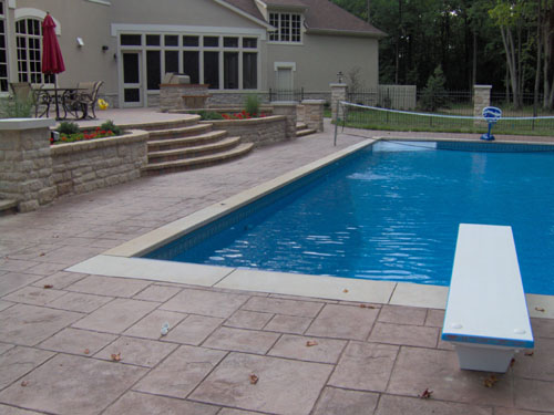This Ashlar Cut Slate stamped pool deck was integrally colored with Davis Colors Rustic Brown concrete color.  The release agent was a Mocca color.
