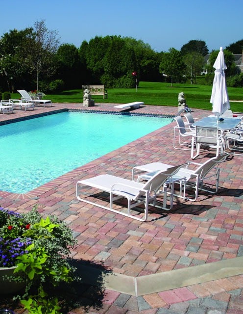 This pool deck is paved with Nicolocks Country pavers with their Autumn color blend.  Nicolock uses Davis Colors concrete pigments to make their custom color blends.  To learn more about Nicolocks products visit them at www.nicolock.com.