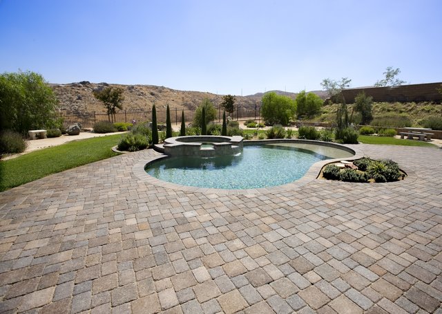 This pool deck was paved with Orco Blocks pavers.  Orco Block uses Davis Colors concrete pigments to create appealing color blends for their concrete pavers.  To learn more about Orcos quality products visit them at www.orcopaverswalls.com/home.htm or call them at 800-473-6725.