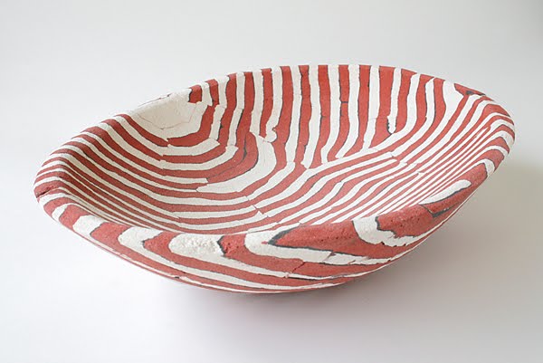 This "Red and White Lined Concrete Basin" (16" x 11.5" x 3.5") was made by Deborah Brackenbury through a unique process of layering hand-rolled and hand-cut colors of concrete (Davis Colors) in molds and wet-carving the green concrete. To learn more about Deborah Brackenbury’s products go to http://impurevessels.com/home.html or call 405-414-8662.