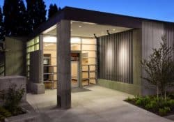 The front entry to the University of Western States (uws.edu) anatomy lab .  The cast in place concrete walls were colored with  Davis Colors "Green Slate" (daviscolors.com). The architect was Office OA, LLC (ooa-architects.com), the general contractor was Precision Concrete Company (T: 503-253-4827), and the concrete contractor was Whitaker/Ellis (T: 503-768-3017).