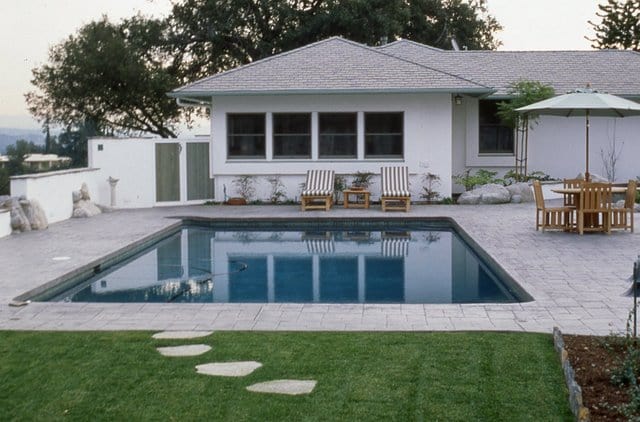 This pool deck was colored with Davis Colors Mocha and stamped with an ashlar slate stamp pattern.
