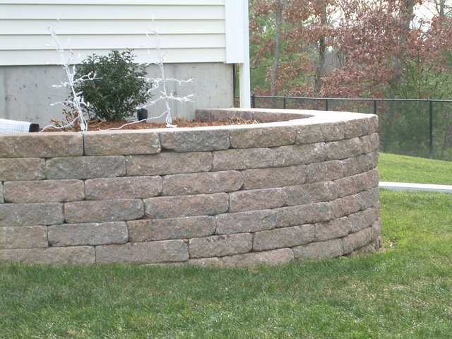 Block wall made with Ideal Concrete Block's Ancestral™ WallStone.  The concrete block was colored with a blend of Davis Colors  pigment #160 and #860.