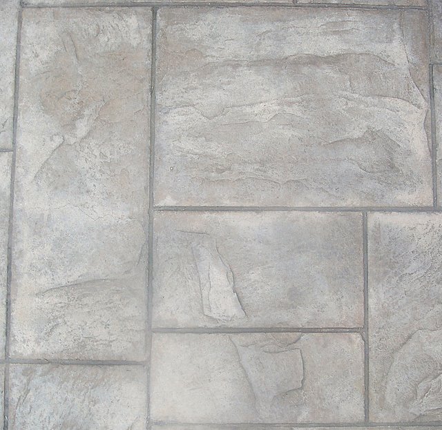 This is a close up photo of a patio in Arcadia, CA that was integrally colored with Davis Colors’ Omaha Tan.  The contractor used an Ashlar Slate stamp pattern along with an antique release agent.