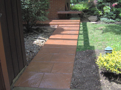 This stamped walkway was integrally colored with Davis Colors’ Terra Cotta concrete color and stamped with a Walkway Stone pattern.  The release agent was a Smokey Beige color.  The concrete work was done by Butch Bando Concrete, Inc. located in Galena, Ohio.  You can reach Butch Bando Concrete, Inc. by visiting their website at www.butchbandoconcrete.com or by calling them at 740-548-7322.  These photos were provide by Butch Bando Concrete, Inc. and are being used with their permission.