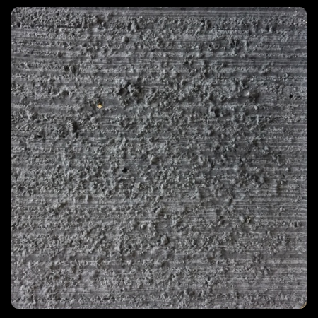 Sample tile colored with Davis Colors Jet Black Iron Oxide concrete pigment