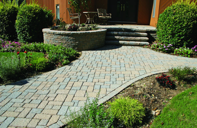 This path is paved with Nicolock’s Village pavers with their Oyster color blend.  The block wall is made with Nicolock’s Mini-Colonial wallstones with their Oyster color blend.  Nicolock uses Davis Colors’ concrete pigments to make their custom color blends.  To learn more about Nicolock’s products visit them at www.nicolock.com.