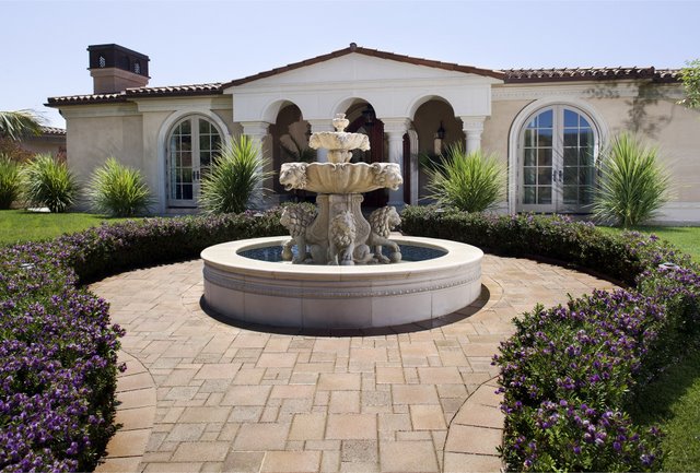 This courtyard was paved with Orco Blocks Promenade pavers and colored with Orcos own unique Sandstone (B15) color blend.  Orco Block uses Davis Colors concrete pigments to create appealing color blends for their concrete pavers.  To learn more about Orcos quality products visit them at www.orcopaverswalls.com/home.htm or call them at 800-473-6725.