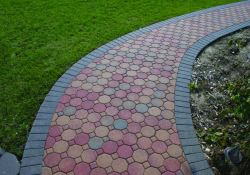 Photos of outdoor walkways created using Davis Colors concrete pigments and pavers