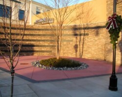 The designers of the Bridgeport Village Shopping Center located in Tigard, Oregon selected Davis Colors’ Brick Red concrete color for parts of the center’s concrete hardscapes. This photo shows the concrete after it has fully cured. Glacier Northwest/CalPortland (www.calportland.com) supplied the colored concrete for this project.