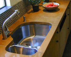 This precast colored concrete kitchen countertop was made by Flying Turtle Cast Concrete (www.flyingturtlecastconcrete.com). The concrete was integrally colored with custom colors using Davis Colors’ quality concrete pigments (www.daviscolors.com).