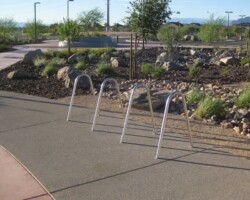 This concrete bike parking area at the Heritage Bark Park in Henderson, NV was colored with Davis Colors’ Mesa Buff and finished with an exposed aggregate. The walkways were colored with Davis Colors’ Baja Red. The landscape design was done by the Design Workshop. To contact the Design Workshop visit their website www.designworkshop.com or call them at 775-588-5929. To learn more about this project go to http://www.landscapeonline.com/research/article/14721.
