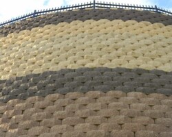 This enormous keystone retaining wall in Abingdon Maryland was built by Griffith Brothers Inc. (410-683-8885) with Keystone Standard units manufactured York Building Products (www.yorkbuilding.com). The colors used were buff, light brown and dark brown.
