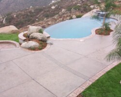 The main pool deck was colored with Davis Colors’ Outback and given a light sand blast finish. The stamped concrete boarders were colored with Davis Colors’ Outback and highlighted with a terra cotta colored release agent. The concrete contractor was New Images Concrete. To learn more about New Images Concrete’s services visit www.newimagesconcrete.com.