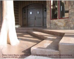 The concrete contractor Riverstone Stamp Concrete used Davis Colors Bayou integral pigment to color the concrete. They used Arizona Flagstone stamps from Proline Concrete Tools and a medium gray liquid release agent. After washing off the release agent, they returned to use a black grout to hand grout all the stamped joints to make it look like real stone. You can reach Riverstone Stamp Concrete by phone at 208-704-7468. The Ready Mix concrete company was Interstate Concrete & Asphalt their phone number is 208-765-1144. To learn more about this project visit the concretenetwork.com.