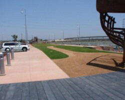 This is a photo of Pier 32 Marina located in National City near San Diego, CA. The concrete sidewalk was colored with Davis Colors Spanish Gold (www.daviscolors.com). The concrete work was done by Mar Vista Construction (www.marvistaconstruction.com). The concrete was supplied by Superior Ready Mix (www.superiorrm.com, sales@superiorrm.com).
