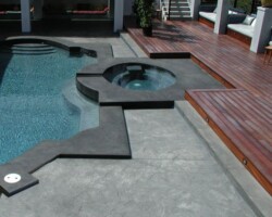 Davis Color's Dark Gray and Petwer concrete colors were used to create a very dramatic stamped concrete pool deck. Bonaza Concrete (bonanzaconcrete.com) supplied the colored concrete on this project.