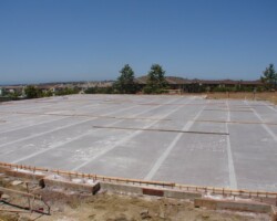 The rolls of McTech Group’s UltraCure NCF™ curing fabric have been rolled out to cover the entire colored slab. This 7 day curing method is designed to provide thorough hydration and even curing for the colored concrete. To learn more about UltraCure NCF™ go to http://www.mctechgroup.com/wc_train.html. UltraCure NCF™ is a registered trademark of McTech Group Inc. The concrete is colored with Davis Colors’ concrete color www.daviscolors.com.