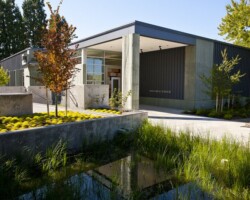 The University of Western States' (uws.edu) anatomy lab and pond. The cast in place concrete building walls were integrally colored with Davis Colors "Green Slate" (daviscolors.com). Every drop of rainwater from the roof is funneled through an intricate cast in place concrete scupper which directs the water into a holding pond filled with water-loving plants. The architect was Office OA, LLC (ooa-architects.com), the general contractor was Precision Concrete Company (T: 503-253-4827), and the concrete contractor was Whitaker/Ellis (T: 503-768-3017). The University of Western States' (uws.edu) anatomy lab and pond. The cast in place concrete building walls were integrally colored with Davis Colors "Green Slate" (daviscolors.com). Every drop of rainwater from the roof is funneled through an intricate cast in place concrete scupper which directs the water into a holding pond filled with water-loving plants. The architect was Office OA, LLC (ooa-architects.com), the general contractor was Precision Concrete Company (T: 503-253-4827), and the concrete contractor was Whitaker/Ellis (T: 503-768-3017).