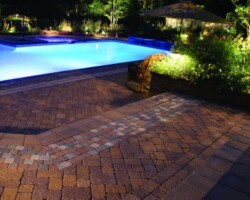 This pool deck is paved with Nicolocks Village (Antiqued) pavers with their Golden Brown color blend. Nicolock uses Davis Colors concrete pigments to make their custom color blends. To learn more about Nicolocks products visit them at www.nicolock.com.