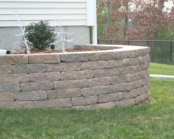 Block wall made with Ideal Concrete Block's Ancestral WallStone. The concrete block was colored with a blend of Davis Colors pigment #160 and #860. Ancestral is a trademark of Ideal Concrete Block Company, Inc. To learn more about Ideal Concrete Block products visit them at www.idealconcreteblock.com.