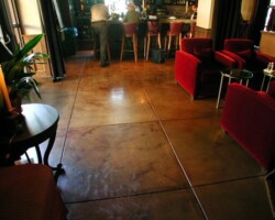 This decorative stamped concrete was designed by Flying Turtle Cast Concrete (www.flyingturtlecastconcrete.com). The integral concrete color was from Davis Colors. Flying Turtle also used other concrete coloring tecniques on the concrete surface.