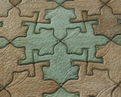 Frogrock™ © 1997 John August - Admittedly inspired by artist M. C. Escher, John August's copyrighted design is uniquely different - transforming a derivative image into a practical art form through a process known as tessellation or tiling - a combination of both art and geometry. August has incorporated this technique into a series of truly interlocking pavers which require no additional borders to keep them from wandering off in your garden. He uses Davis Colors exclusively to accent his work, saying simply, besides looking good, color sells. To find learn more about John Austust's products visit his website at www.geckostone.com or call him at 888-976-1190. Photo is copyrighted by Geckostone - John August.