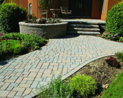 This path is paved with Nicolock’s Village pavers with their Oyster color blend. The block wall is made with Nicolock’s Mini-Colonial wallstones with their Oyster color blend. Nicolock uses Davis Colors’ concrete pigments to make their custom color blends. To learn more about Nicolock’s products visit them at www.nicolock.com.