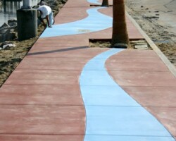 This walkway at the Oceanside, CA marina was integrally colored with Davis Colors' Euroblue and Tile Red. The concrete has a broom finish.