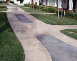 This concrete sidewalk was integrally colored with Davis Colors' Padre Brown with a Walnut release agent and Davis Colors' Meadowbrook Brown (custom color). The colored concrete was supplied by Superior Ready Mix (www.superiorrm.com).